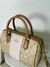 Bolsa Coach con strap de tela grabado en internet