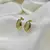 Brinco concha banhada a Ouro 18K