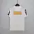 Camisa retrô branca do Santos com logo BMG na parte de trás e mangas com a marca NETSHOES.