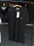 Camiseta preta da marca Dior, com logo discreto no peito.