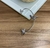Ear Cuff Metálica Unilateral com Coração e Strass - comprar online