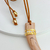 Colar Cordão Couro Dente Bege Detalhe Dourado na internet