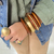 Bracelete em Madeira com Bolas Douradas Foscas - Lia Franco