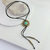 Colar Cordão Couro Broche Ouro Velho Pedra Turquesa - comprar online