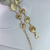 Cinto Metal com Flores e Corrente Dourado