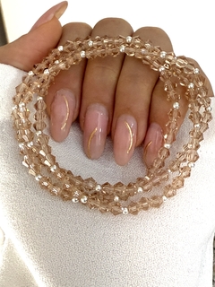 Pulsera cristal beige bicono traslúcido y bolita 3x1 (elastizada)