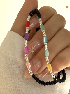 Pulsera negra tubitos color nácar - comprar online