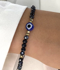 Pulsera hilo negro ojo turco azul y dorado ajustable