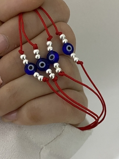 Pulsera de hilo ojo turco azul y bolitas de plata