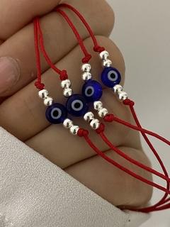 Pulsera de hilo ojo turco azul y bolitas de plata - comprar online