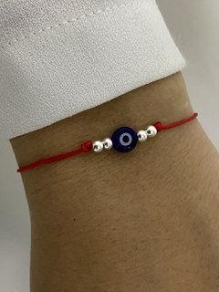 Pulsera de hilo ojo turco azul y bolitas de plata - Vogamayorista
