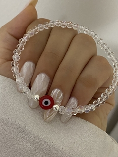 Pulsera cristal elastizada transparente y ojo rojo