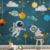 Papel de Parede Universo Infantil com Estrelas e Astronauta e Foguete Para Quarto e Sala