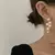 Brincos de Pérola Branca Extragrandes com Zircão e Acabamento Dourado - Elegâ na internet