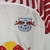 Conjunto infantil do Red Bull Leipzig I 23/24 da Nike, em branco com detalhes em vermelho, composto por camiseta e short.