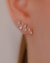 Brinco Ear Cuff com Zirconias de Diferentes Tamanhos no Dourado com Cristal