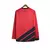 Camisa longa do Athletico Paranaense na cor vermelha com detalhes em preto e logo da Umbro

