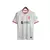 Camisa branca do Liverpool II 24/25 com detalhes em vermelho, fabricada pela Nike, exibindo o logotipo do time e a marca patrocinadora.