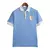 Camisa azul da Seleção Uruguai I 24/25, modelo masculino, com detalhes em branco e escudo bordado.