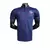 Camisa polo azul do Barcelona 23/24 da Nike para treino masculino, exibida em manequim.