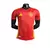 Camisa vermelha da Seleção da Espanha I 24/25, com detalhes em amarelo, modelo masculino da Adidas.