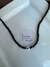 Choker cristales negros con dije ojito turco.