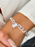PU91194 - PULSEIRA ELOS ENTRELAÇADOS CORAÇÃO ZIRCÔNIA - FOLHEADO A PRATA 925
