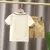 Conjunto de camiseta e shorts de algodão de manga curta infantil na internet