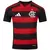 Camisa do Flamengo 2025/26, modelo home, com listras vermelhas e pretas e logo do clube.