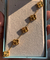 Pulseira com 5 trevos no banho dourado - Camila Kruk Semijoias