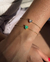 Pulseira delicada com coração em Esmeralda colombiana no banho Ouro