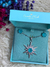 Conjunto de estrela com Turmalina Azul cravejada no banho Ródio Branco