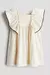 VESTIDO BEIGE “HYM” CON VOLADOS y VIVOS NEGROS