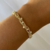 Pulseira Bolinha Com Perolas Penduradas na internet