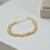 Pulseira Bolinha Com Perolas Penduradas