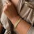 Bracelete Com Linhas Cravejadas e Fecho Infinito na internet
