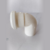 Joelho de 50mm da marca Plastubos, em formato de cotovelo, usado em tubulações.