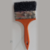 Trincha preta de 101,6 mm com cabo laranja, ideal para pintura.