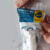 Embalagem do Sifão Tubo Extensivo Universal da Blukit, mostrando o produto e instruções de instalação.