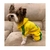 Cachorro vestindo Macacão de Moletom Adidog para pets, cachorro e gato, modelo fechado mangas, pernas e capuz em moletom felpado, na cor amarelo com listras verde, cores do Brasil, com estampa ADIDOG – produto importado.