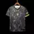 Camiseta de futebol com estampa de folhas, predominantemente preta, com detalhes em amarelo e verde, e logo da seleção brasileira.