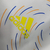 Jaqueta Corta-Vento Real Madrid 21/22 - Masculina Adidas - Branca com detalhes em azul e amarelo - CAMISAS DE FUTEBOL | NnStore