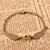 Pulseira com Pomo de Ouro – Um Toque Mágico no Seu Estilo! - comprar online