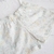 CONJUNTO BODY, BABERO Y SHORT "FLORECER" en internet