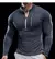Camiseta esportiva masculina de manga comprida na cor cinza, com zíper frontal e ajuste ao corpo.