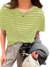 Modelo usando blusa feminina listrada verde claro, combinada com calça cinza e acessórios modernos.