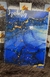 Caderno personalizado com fundo azul e detalhes em dourado, com o nome "Izabelly" na capa.