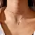Colar lindo e exclusivo com pingente cruz de cruz feminino, corrente e detalhes oval dourado e prateado