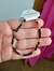 Pulsera perlas negras y doradas