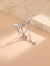 Piercing de ombligo corazón con alas - comprar online